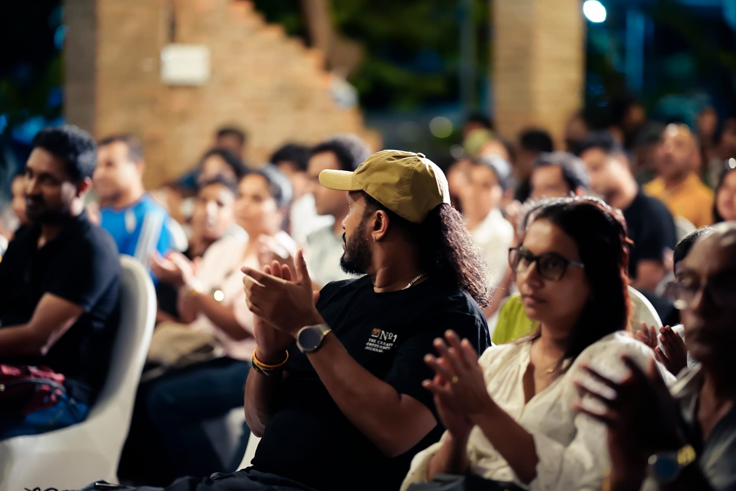 Performers, speakers and the audience at an evening event, photo 9 of 13