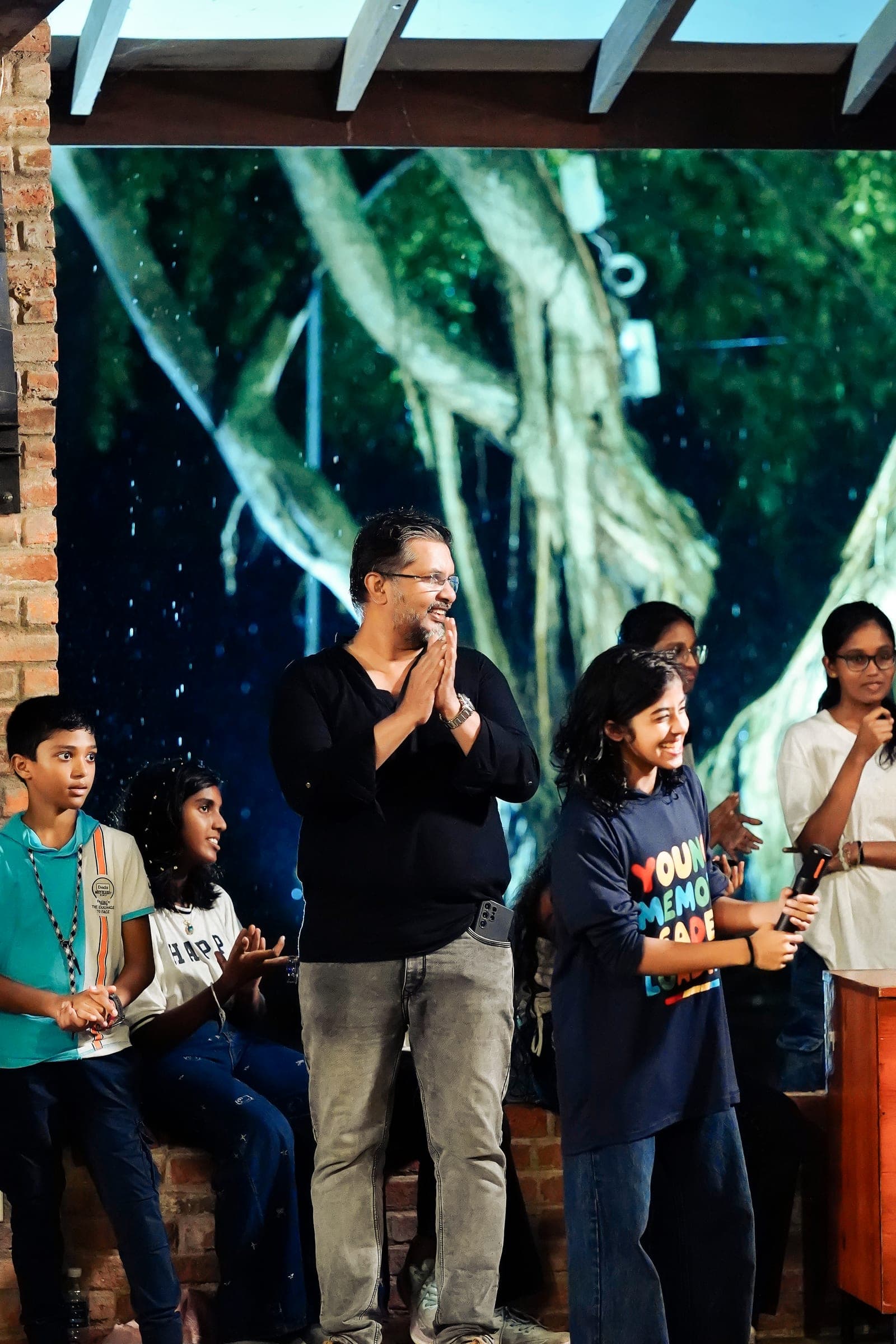 Performers, speakers and the audience at an evening event, photo 11 of 13