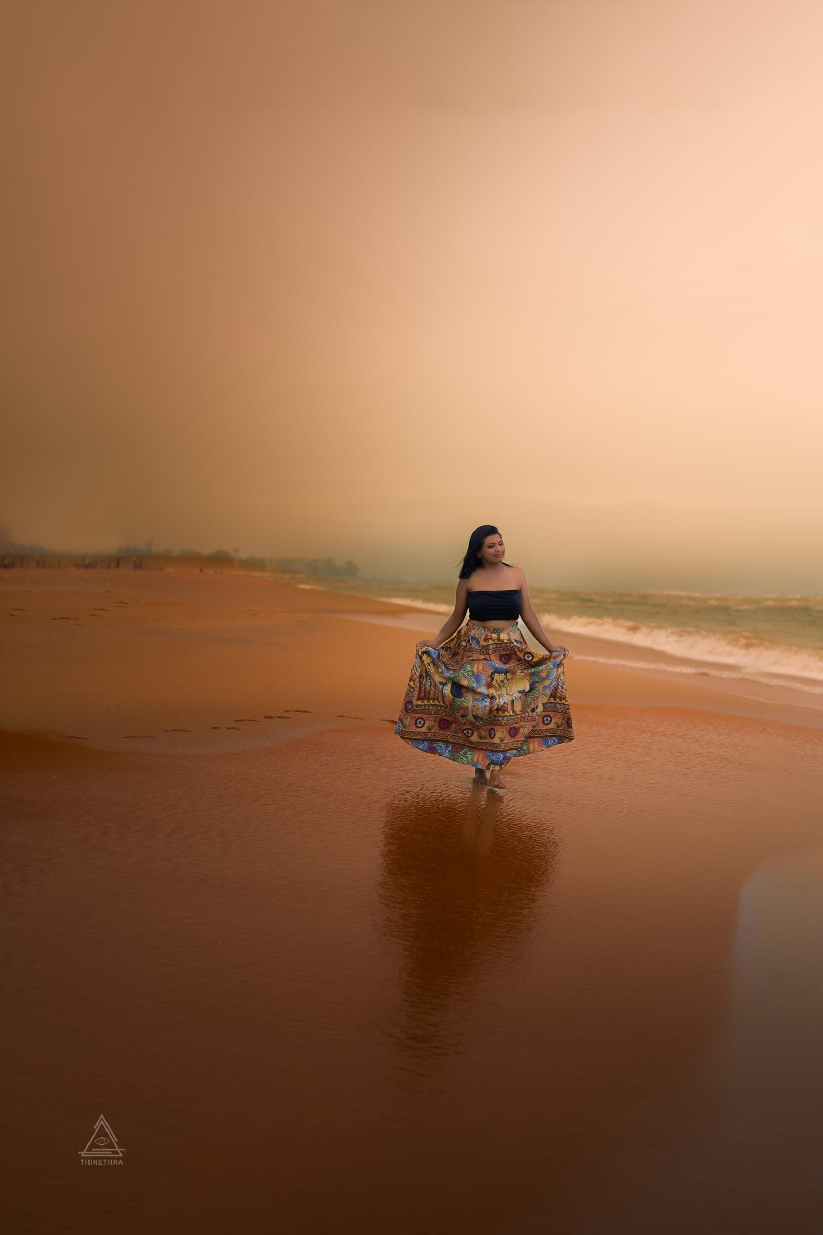 Chandima and her son on the beach at sunset, photo 1 of 13