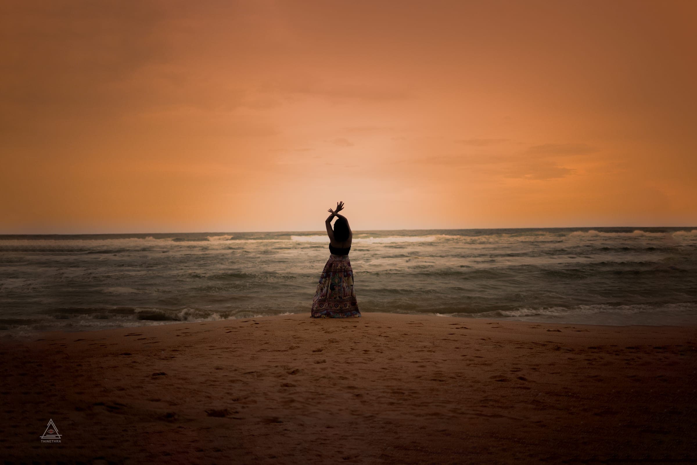 Chandima and her son on the beach at sunset, photo 2 of 13