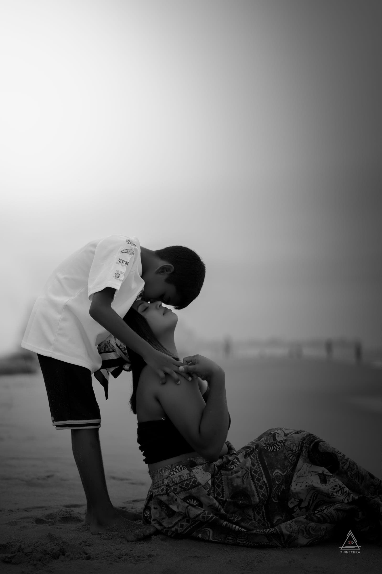 Chandima and her son on the beach at sunset, photo 13 of 13