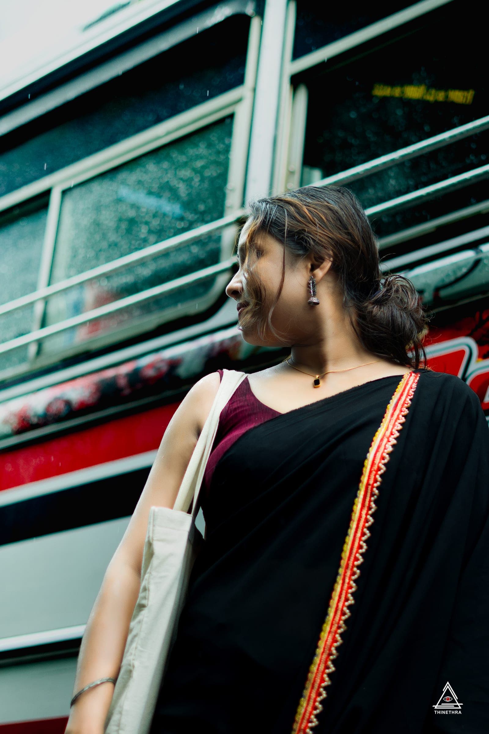 Portrait of Sandu in a black saree in the city, photo 3 of 26