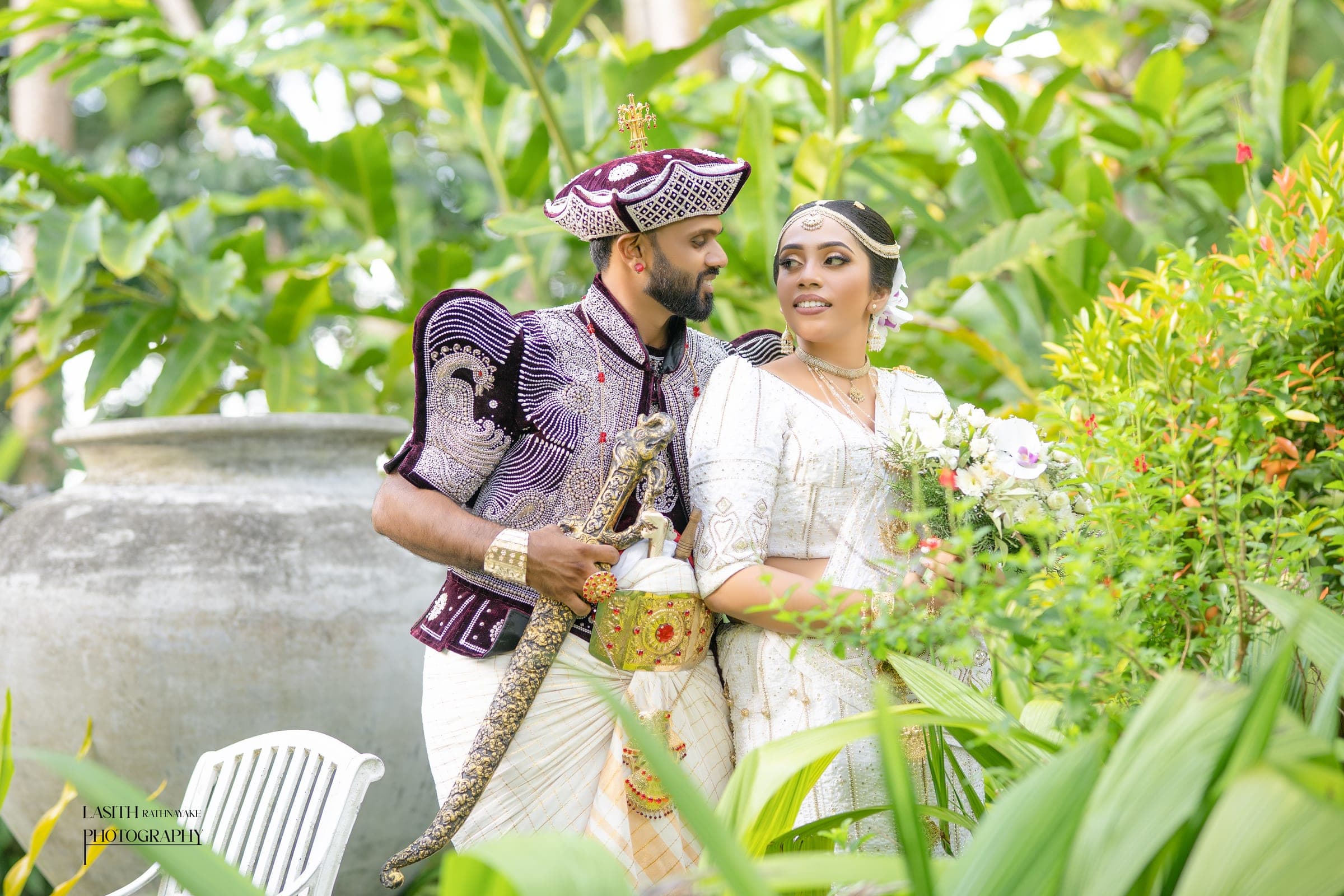 Tharushi and her groom in Kandyan wedding dress, photo 9 of 27